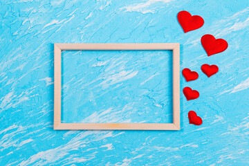 Background Of Valentines Day. red hearts on a blue background. flat lay. space for copying text