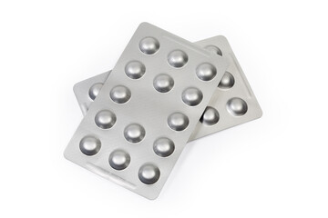 Foil blister packs of pills on white background, top view