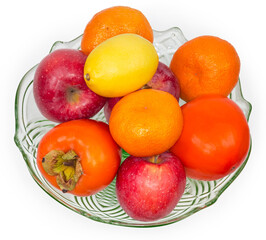 Different fruits in vintage glass fruit vase, top view