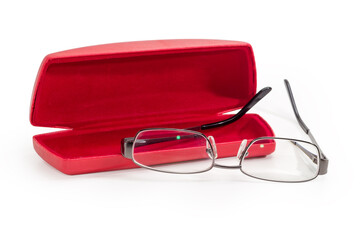 Modern eyeglasses in metal gray rim against red spectacle-case