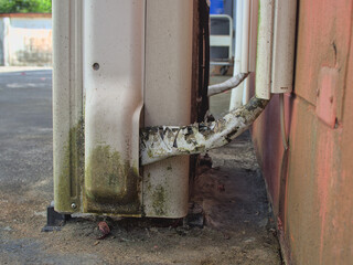 Old, dirty outdoor condensing unit with maintenance issue .