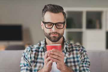 Photo of young handsome stubble man happy positive enjoy aroma morning cup of coffee break pause...