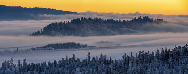  beautiful panorama of the mountain landscape during a glorious frosty and misty sunrise