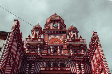 A low angle shot of the Jami-Ul-Alfar Mosque in Colombo, Sri Lanka on a gloomy sky background