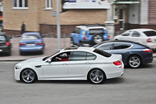 Kiev, Ukraine - April 22, 2012: BMW M5 F10 and Porsche Panamera in the city. Car in motion