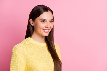 Fototapeta premium Portrait of young beautiful charming smiling positive good mood girl look copyspace isolated on pink color background