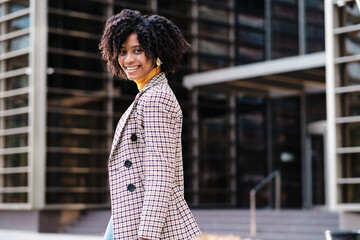 African american woman standing outdoors.
