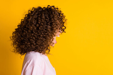 Photo portrait profile of screaming woman's face covered by hair isolated on vivid yellow colored background
