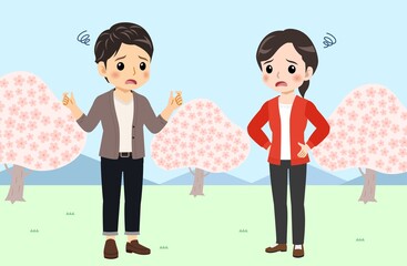 Young men and women in front of Sakura in spring