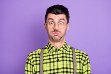 Obraz premium Photo portrait of funny man with puff cheeks isolated on vivid violet colored background