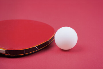 Pair of red ping-pong rackets and white ball, isolated on white background