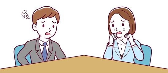 Male and female employees having a meeting