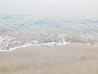 Wave crushing on the empty beach