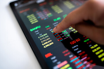 Stock market showing on digital tablet computer