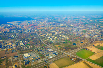 Flying above Malmo city in Sweden . Swedish coastal city aerial view 