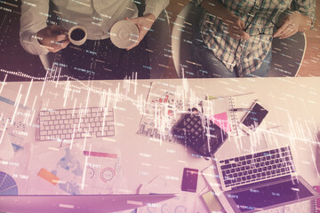 Double exposure of man and woman working together and financial chart hologram drawing. market analysis concept. Computer background. Top View.