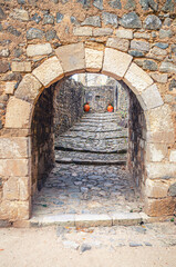 Arch in stone wall of medieval Castle of Leiria Castelo de Leiria building in historical city centre, Portugal