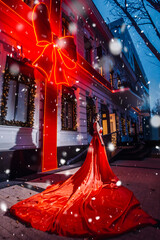 Beautiful woman in red dress in christmas