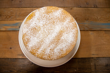 A delicious basic sponge cake with cream in a kitchen