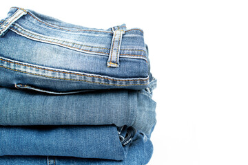 Jeans trousers stack on white background