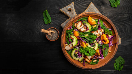 Ketogenic, paleo diet breakfast. Purple cabbage, avocado, spinach, tomatoes, fillets and nuts. Delicious breakfast or snack on a light background, top view.