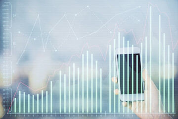 Double exposure of forex chart sketch hologram and woman holding and using a mobile device. Stock market concept.