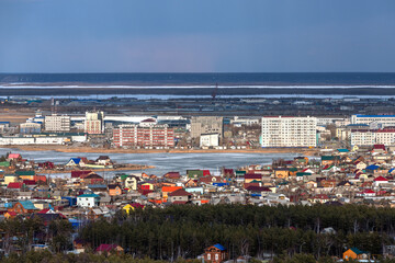 Aerial view of Yakutsk skyline with a small lake in the evening