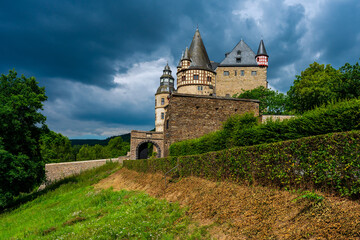 Fototapeta na wymiar Storm clouds over Bürresheim Castle, Germany.