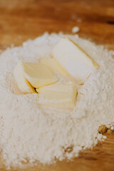 butter and flour ingredients closeup photo on a wooden table