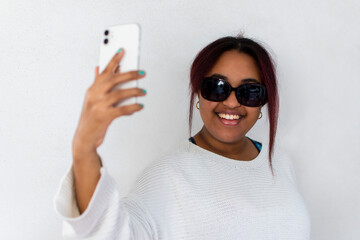 Selfie - Young woman with sunglasses - African