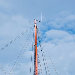 mast of the sailboat, sail and rope