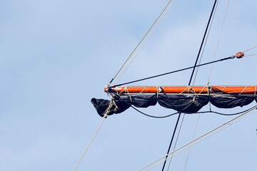 mast of the sailboat, sail and rope