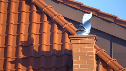 Wind Directional Cowl on Chimney Rotating Gently on Wind