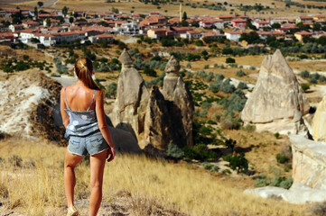 Young woman in the middle of Cappadocia valley