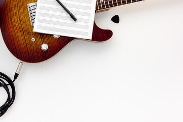 Musician work set with guitar, note and headphones