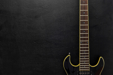 Desk of musician for songwriter work set with headphones and guitar