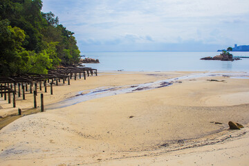 Beach Scene in Penang island, Malaysia. Beautiful stones and turquoise water