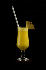 Pineapple Fresh fruit juice on black background 