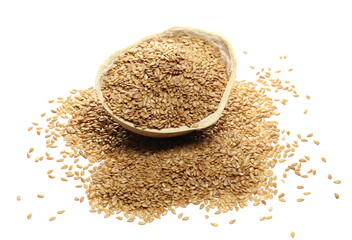 Golden linseed, linen seed pile with calabash gourd half isolated on white background