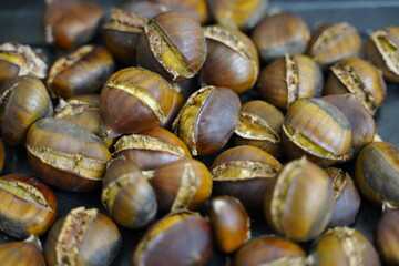 Roasted chestnuts are ready for sale hot.