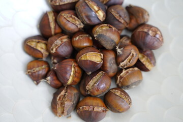 Roasted chestnuts are ready for sale hot.