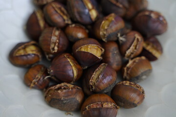 Roasted chestnuts are ready for sale hot.