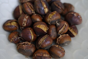Roasted chestnuts are ready for sale hot.
