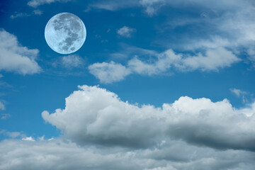 Naklejka na ściany i meble Blue sky with clouds and full moon.
