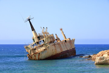 Shipwreck of the abandoned ship Edro III on a rocky coast at Akrotiri Beach in Cyprus