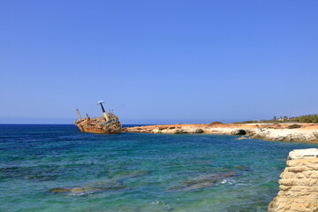 Shipwreck of the abandoned ship Edro III on a rocky coast at Akrotiri Beach in Cyprus