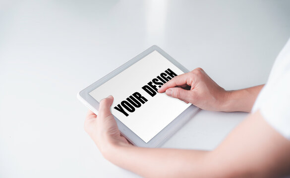 Mockup of a woman using a white tablet On her desk, Copy space, Clipping path