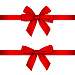 Red bow with ribbon isolated on white.