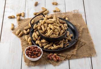 roasted peanuts kept in a metal plate or bowl as snack