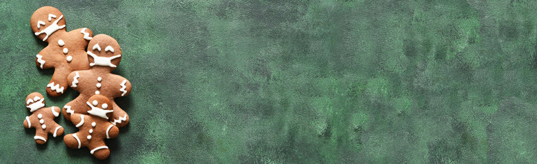 New year concept. Gingerbread family in masks on a green concrete background. View from above.